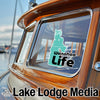 "Wanahee Life" sticker on a boat window with "Lake Lodge Media" text.