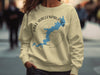 Light yellow sweatshirt featuring Lake Wallenpaupack map and compass design with text.