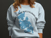 Light blue sweatshirt with blue map of Lake Chaubunagungamaug, Massachusetts.