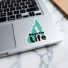 Teal sticker on laptop with "Payette Life" text in black font.