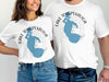 White t-shirts featuring blue Lake Tohopekaliga, Florida map design with compass.