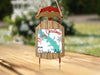 Red metal and wood sled ornament with "Merry Christmas" and "From Waurika Lake".