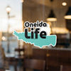 Oneida Life sticker on glass with teal shape and small copyright text