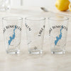 Three clear pint glasses with blue Lake Bomoseen map and compass design.