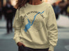 Cream sweatshirt with Great Sacandaga Lake map and compass design.