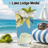 Glass with a blue map design and "NDENHALL LAN" text on a beach background.