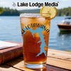 Glass with iced tea, blue Lake Lotawana map graphic, and lemon slice.
