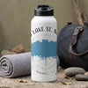 White water bottle with black lid, compass design, and "Lake St. M" text.