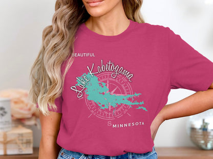 Pink t-shirt with Lake Kabnetogama Minnesota map and compass graphic.