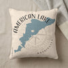 Pillow with blue American Lake map, compass rose, and text.
