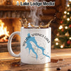White mug with Willow Springs Lake map design and coffee splashing.