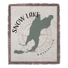 Woven blanket with Snow Lake map outline, compass rose, and text.