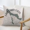 Pillow with Lake Charlevoix Michigan map and compass design.