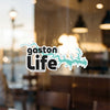 Gaston Life sticker with turquoise lake outline and copyright text.