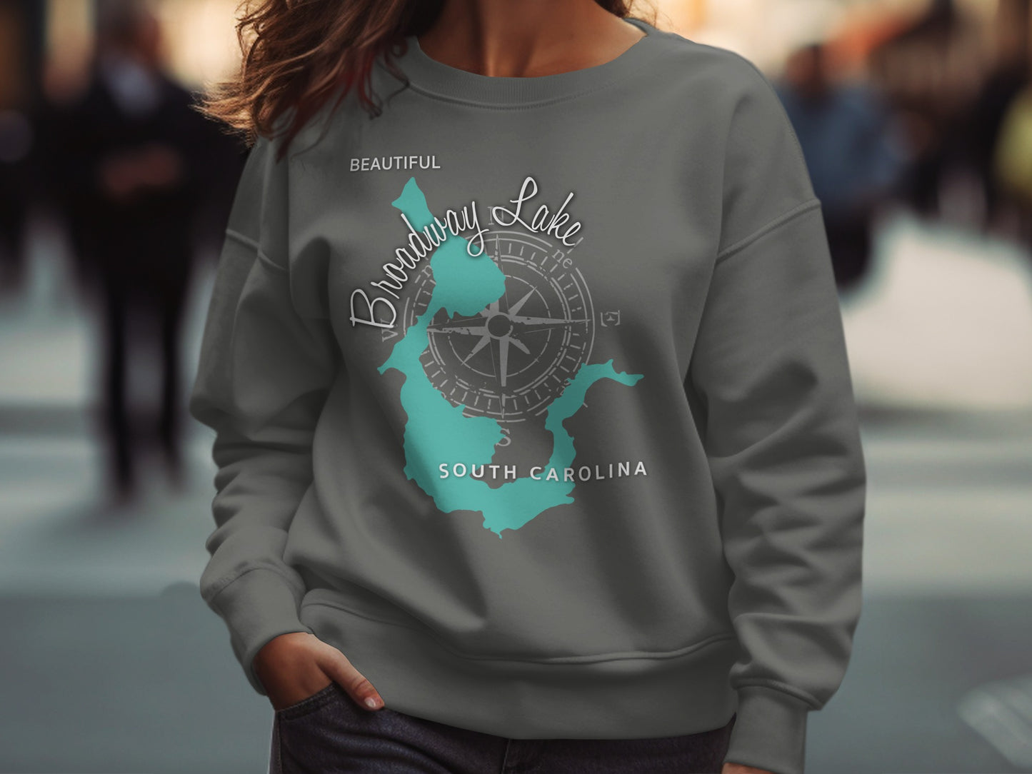 Grey sweatshirt featuring a teal map of Broadway Lake, South Carolina, with compass rose.