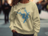 Light yellow sweatshirt with Badin Lake, NC map and compass graphic.