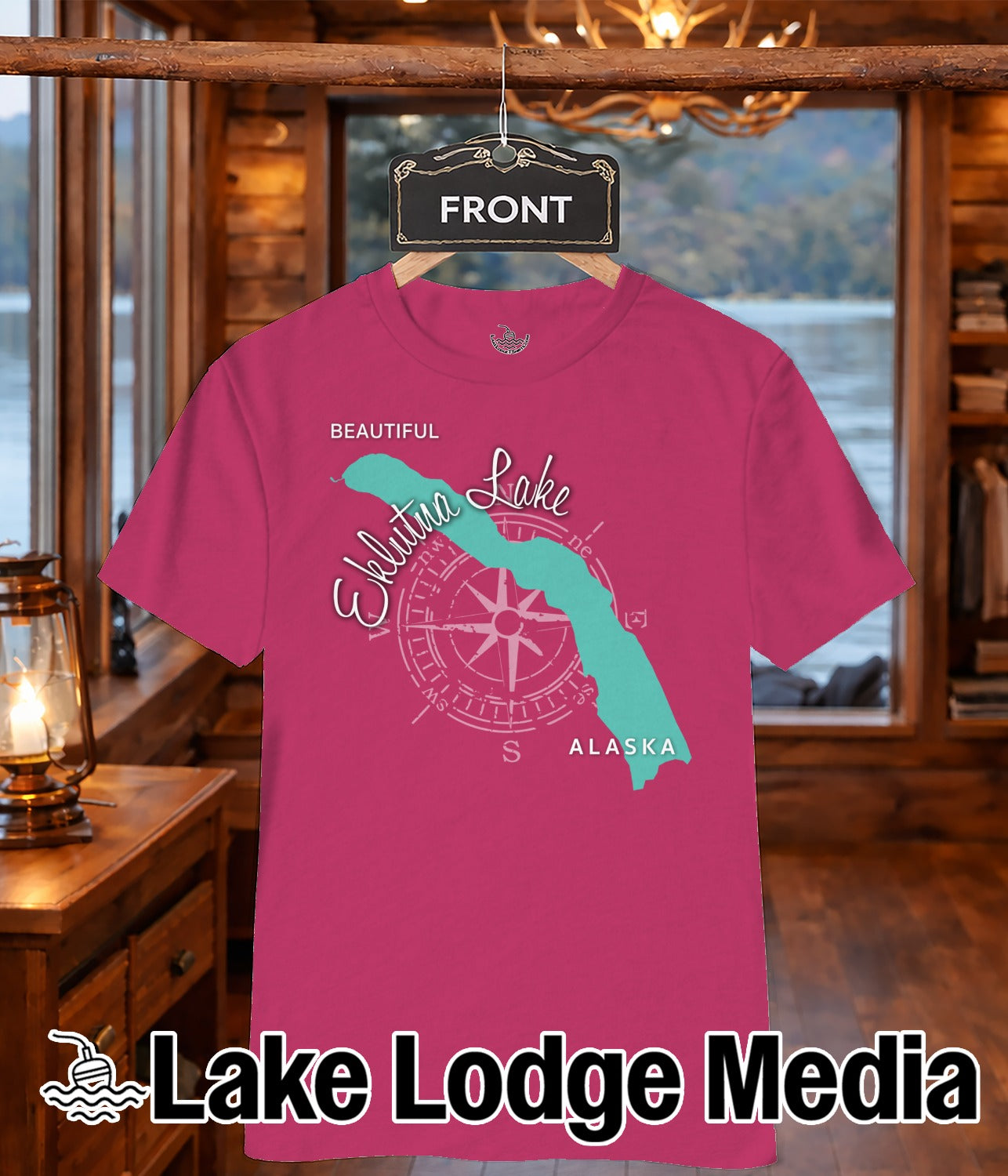 Pink t-shirt with Eklutna Lake map, compass rose, and "Lake Lodge Media" text.