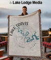 Woven blanket with Lake Travis map and compass design, held by a man.