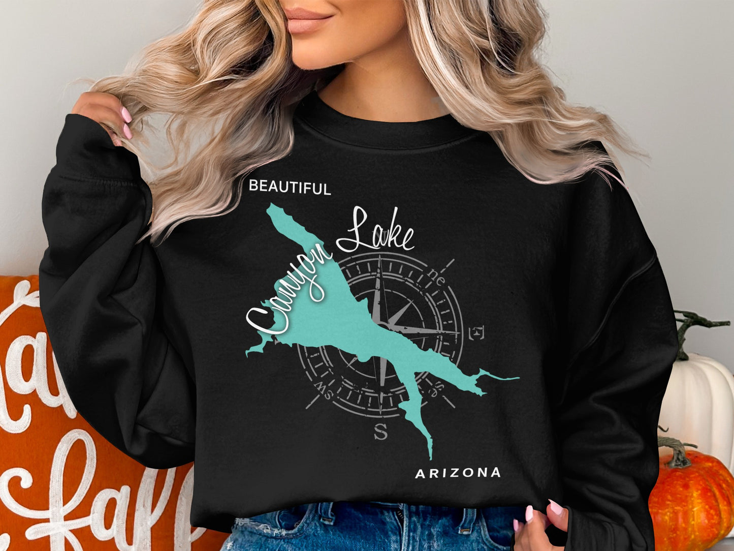 Black sweatshirt with teal Canyon Lake Arizona map and compass graphic.