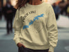 Cream sweatshirt with Prior Lake Minnesota map and compass graphic.