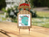 Christmas ornament shaped like a wooden sled with "Merry Christmas from Red Lake" text.