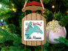 Sled ornament with "Merry Christmas From Lake Manawa" text and snowflakes.