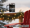 Black mug with "First Christmas 2030" and festive illustration.