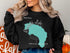 Black sweatshirt with "Beautiful Garibaldi Lake British Columbia" text and turquoise map outline.