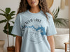 Light blue t-shirt with Pactola Lake map and compass graphic, South Dakota.