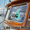 Lake Lodge Media logo on a boat window with Monticello Life sticker.