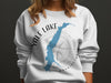 White sweatshirt with Yale Lake, Washington map and compass graphic.