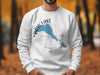 White sweatshirt featuring a blue Bow Lake Alberta map outline and compass graphic.