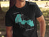 Black t-shirt with teal Forest Lake map and compass rose graphic.