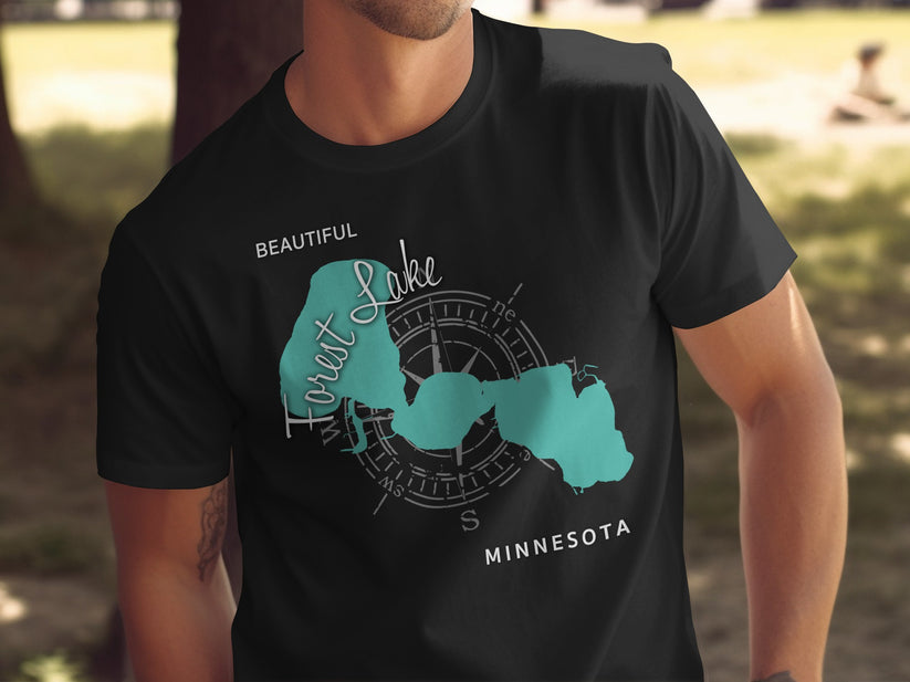 Black t-shirt with teal Forest Lake map and compass rose graphic.