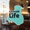 Turquoise irregular shape sticker with black text "Emerald Life" and copyright.