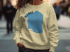 Cream sweatshirt with blue Red Lake, Minnesota graphic and text.