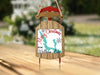 Sled ornament with "Merry Christmas from Walloon Lake" and lake outline design.
