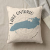 Cushion with Lake Ontario map, compass rose, and text.