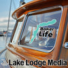 Turquoise Baker Life sticker on a boat window with Lake Lodge Media logo.