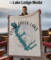 Man holding a Cedar Creek Lake Texas map blanket with fringe.