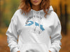 White hoodie with "Rainbow Lake Maine" text and blue map outline on compass.