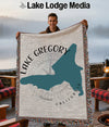 Woven blanket featuring a teal map of Lake Gregory, California, with text.
