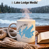 White mug with Leech Lake, Minnesota map design beside a book and scarf.