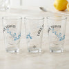 Three clear glasses each feature "Lake Travis Texas" text and a blue map outline with a compass rose.