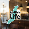Teal cutout sticker with black text "Redfish Life" and copyright Lake Lodge Media LLC.