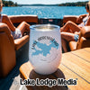 A white travel tumbler featuring a Lake Arrowhead graphic, sitting on a wooden boat table.
