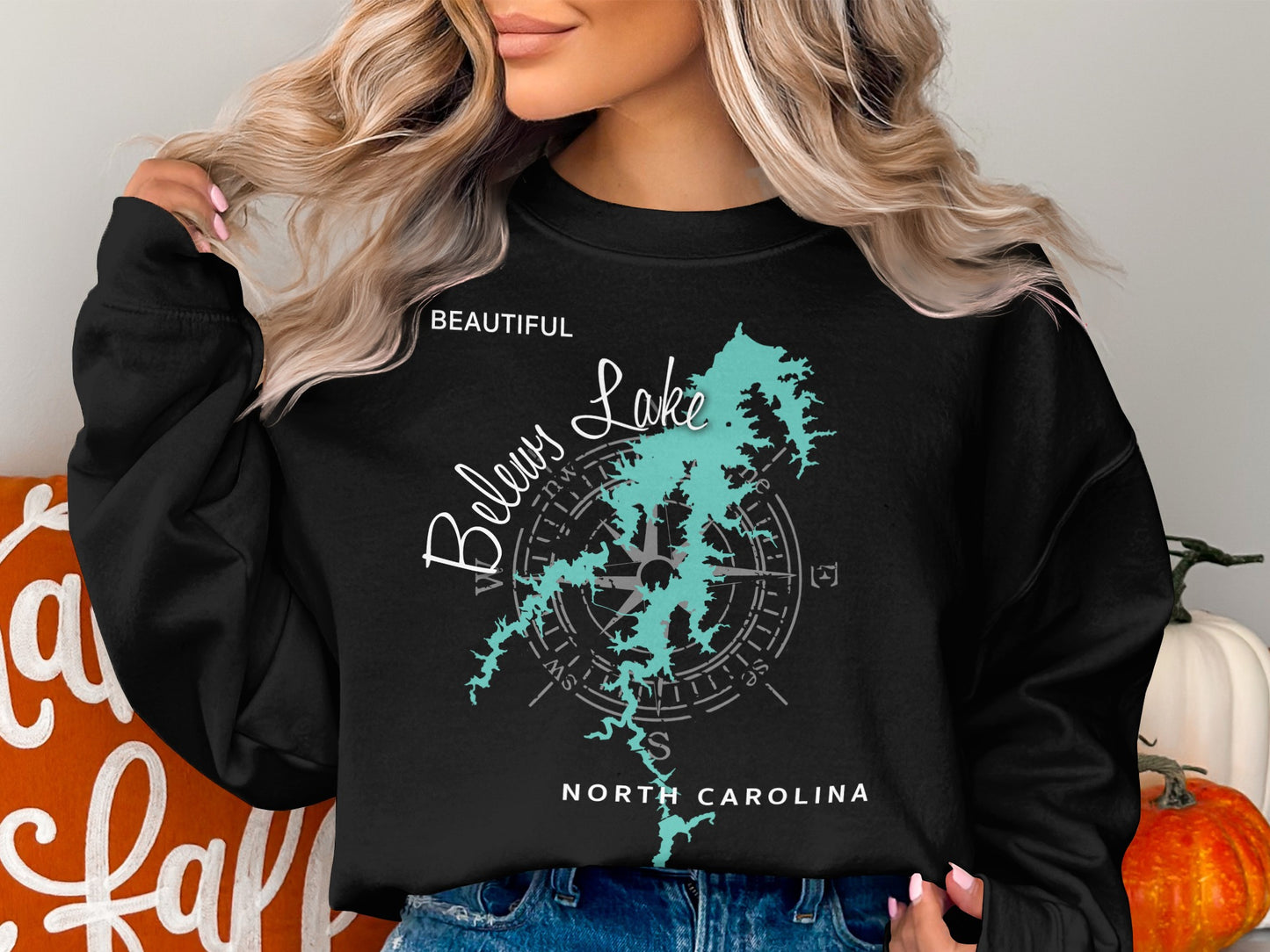 Black sweatshirt with "Beautiful Below Lake" compass design and "North Carolina" text.
