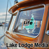 Calcasieu Life sticker on a boat window with Lake Lodge Media logo.