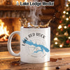 White mug with "Lake Red Rock Iowa" and compass design, splashing hot beverage.