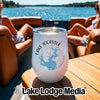 White stainless steel wine tumbler featuring Lake Jocassee graphics, resting on a boat table.
